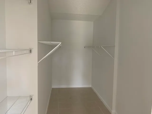 a view of an empty walk in closet