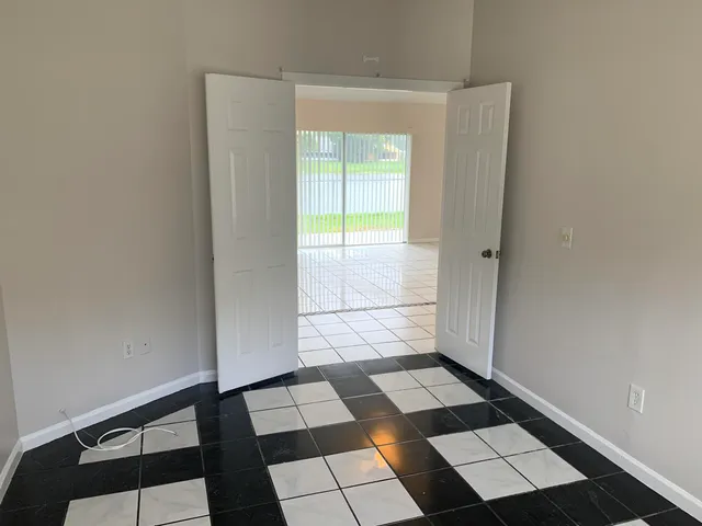 a view of a black and white checkered floor