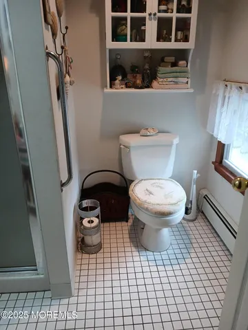 a view of a bathroom with a sink and a mirror