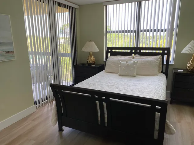 a view of a dining room with furniture and window