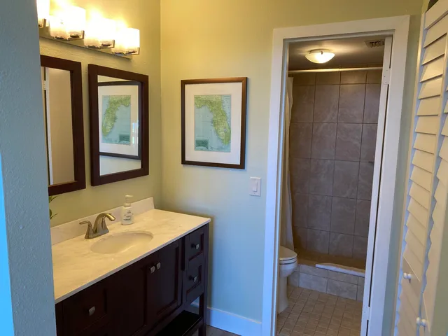 a bathroom with 2 sink and a mirror