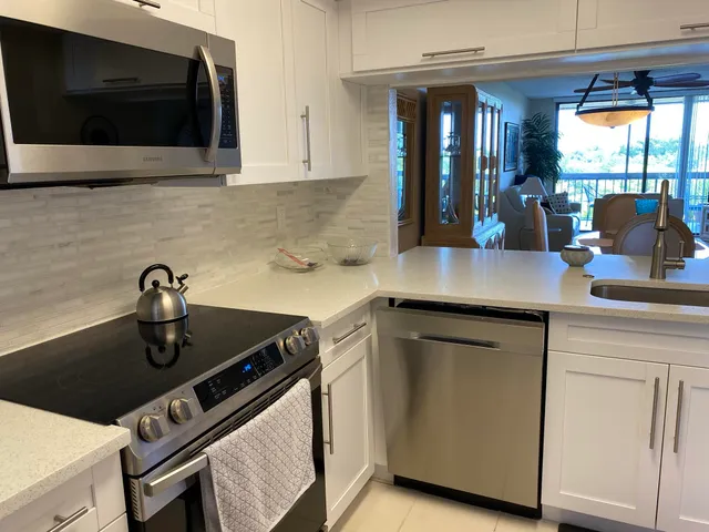 a kitchen with a sink and cabinets