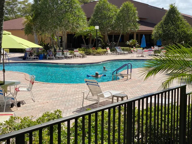 a view of a backyard with sitting area