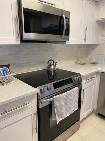 a kitchen with a stove and a microwave