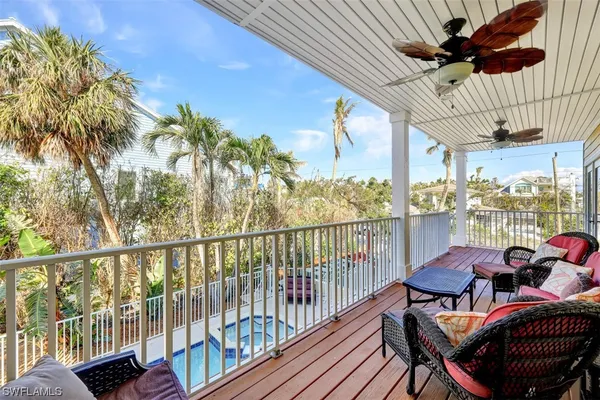 a view of balcony with furniture