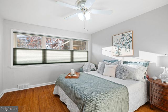 a bedroom with bed and window