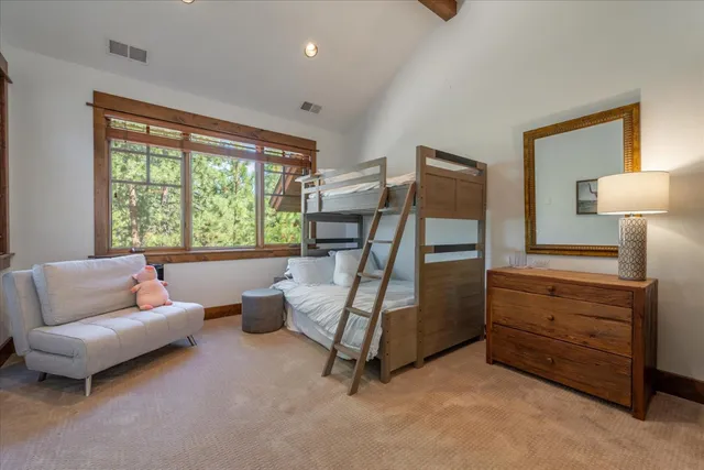 a bedroom with furniture and a window