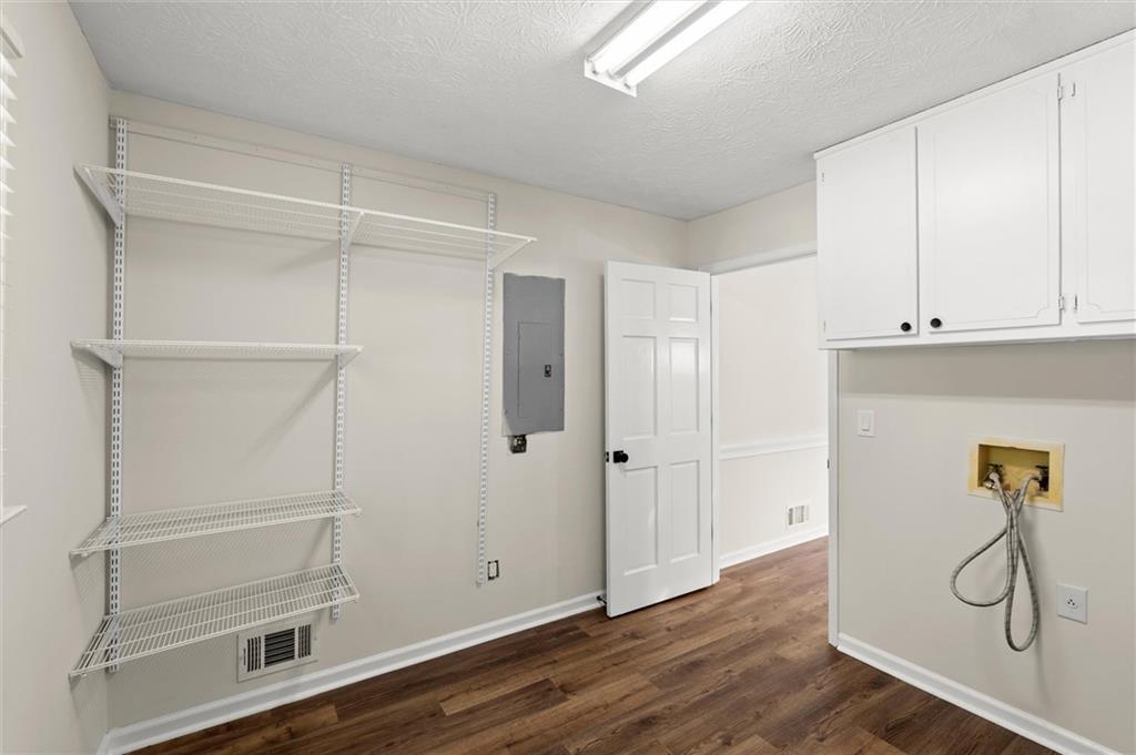 4922 Signal Court Southwest Lilburn, GA 30047 - Photo 16 of 49 a view of empty room with wooden floor