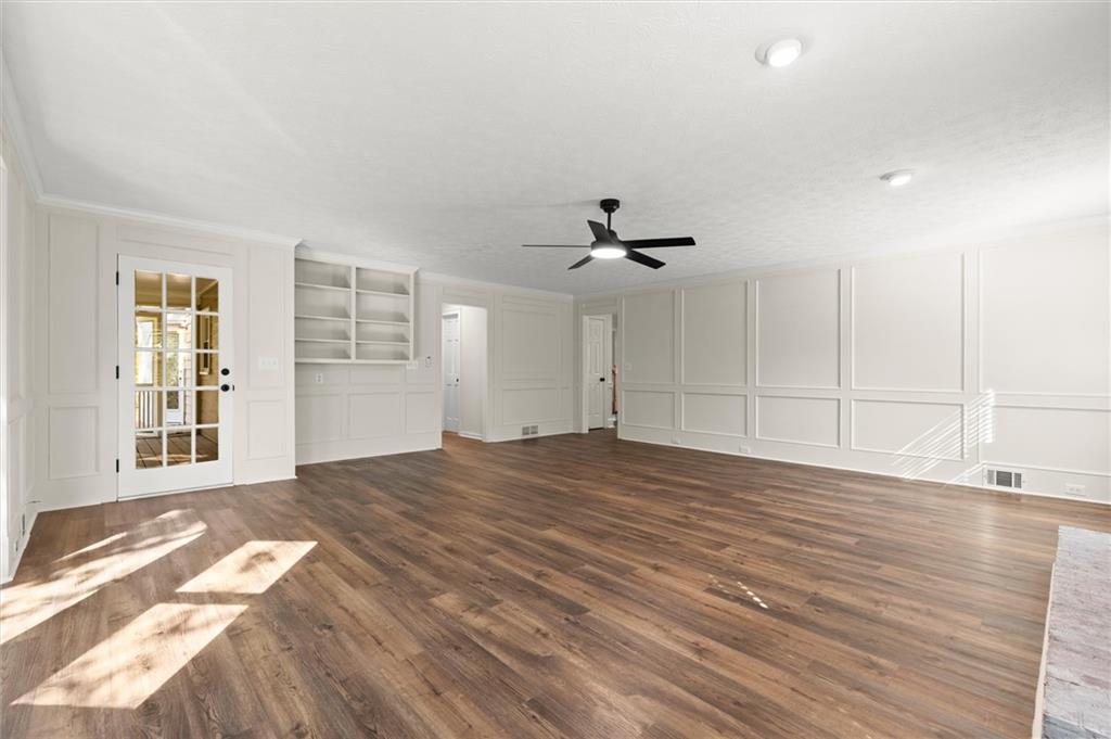 4922 Signal Court Southwest Lilburn, GA 30047 - Photo 19 of 49 a view of empty room with wooden floor and fan