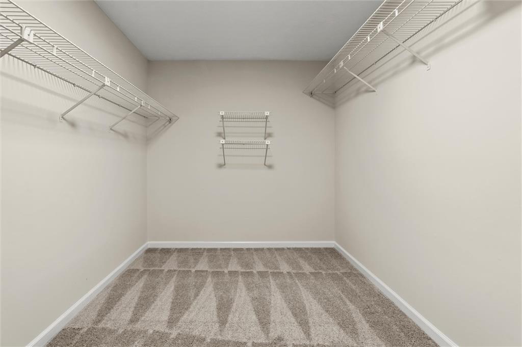 4922 Signal Court Southwest Lilburn, GA 30047 - Photo 29 of 49 a view of a room with racks on the wall