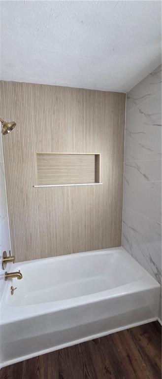 4922 Signal Court Southwest Lilburn, GA 30047 - Photo 35 of 49 a bathroom with a bathtub