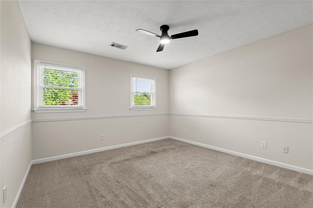 4922 Signal Court Southwest Lilburn, GA 30047 - Photo 38 of 49 an empty room with a window