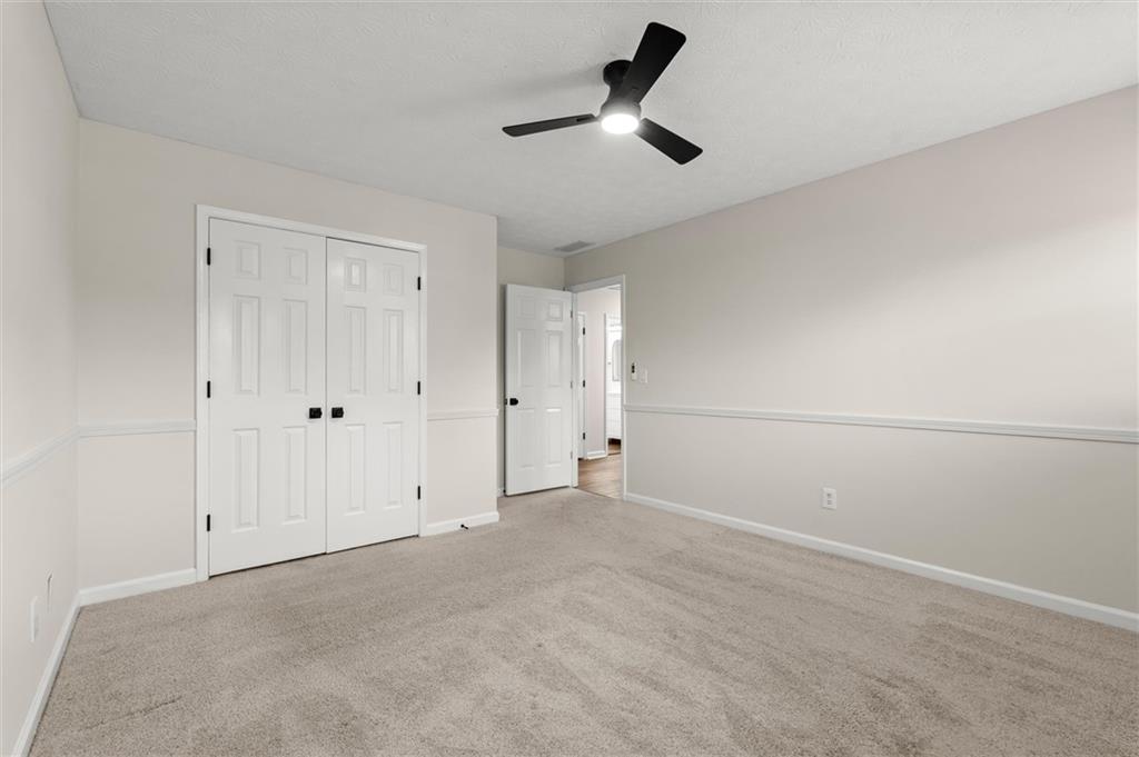 4922 Signal Court Southwest Lilburn, GA 30047 - Photo 39 of 49 a view of an empty room