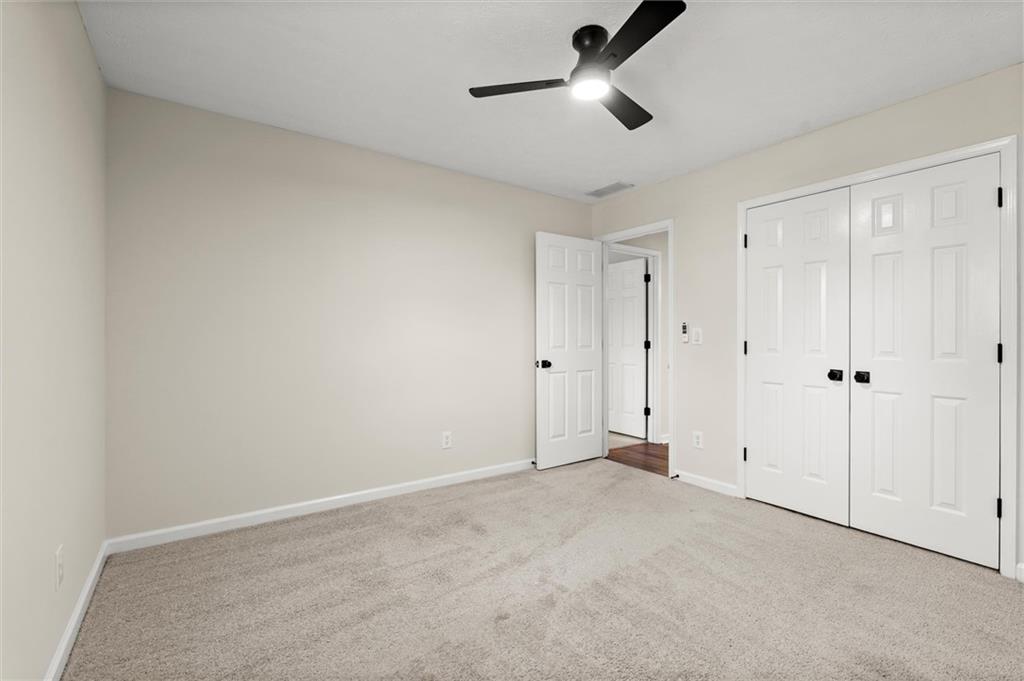 4922 Signal Court Southwest Lilburn, GA 30047 - Photo 41 of 49 a view of an empty room