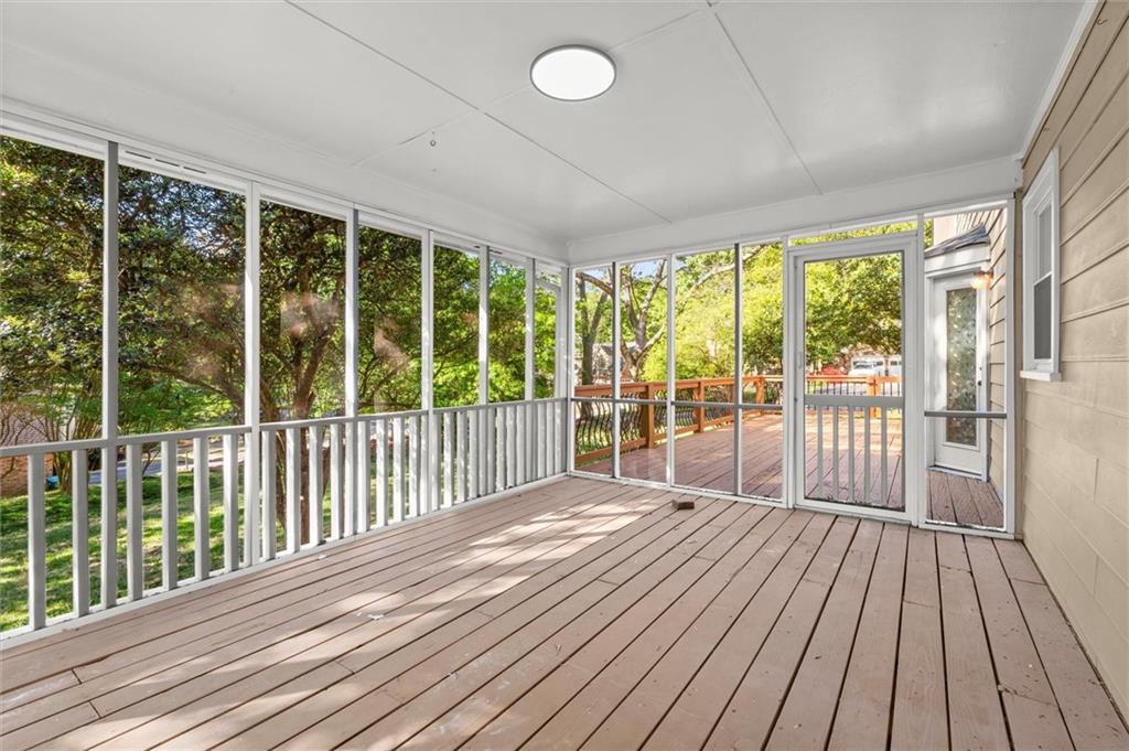 4922 Signal Court Southwest Lilburn, GA 30047 - Photo 43 of 49 a view of a balcony with wooden floor