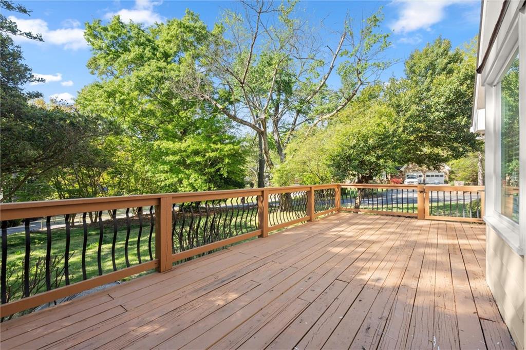 4922 Signal Court Southwest Lilburn, GA 30047 - Photo 45 of 49 a view of balcony with wooden floor and fence