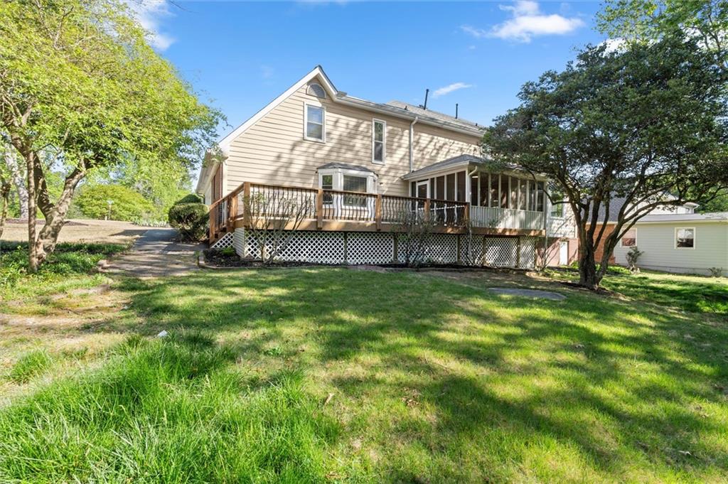 4922 Signal Court Southwest Lilburn, GA 30047 - Photo 47 of 49 a view of a house with a yard