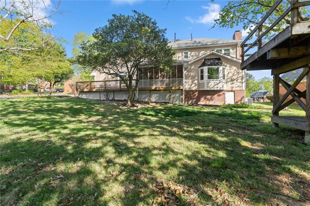 4922 Signal Court Southwest Lilburn, GA 30047 - Photo 49 of 49 a front view of a house with a yard