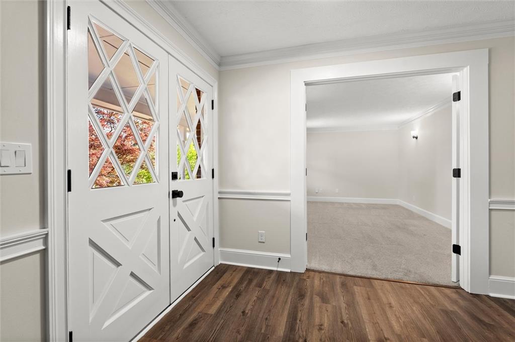 4922 Signal Court Southwest Lilburn, GA 30047 - Photo 6 of 49 a view of an entryway with wooden floor