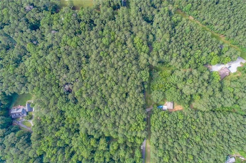 0 Old Grogan Road Acworth, GA 30101 - Photo 11 of 13 a backyard of a house with lots of green space and a fountain
