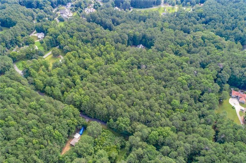 0 Old Grogan Road Acworth, GA 30101 - Photo 5 of 13 a view of a forest with a street