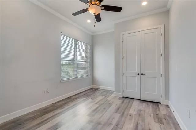 a view of an empty room and wooden floor