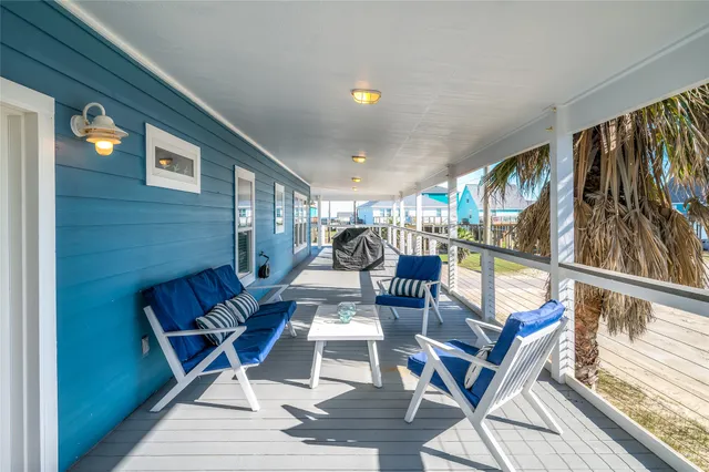 a view of a house with swimming pool and sitting area