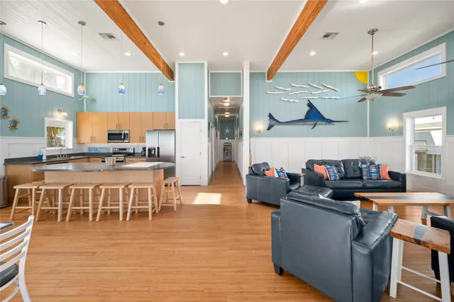 a large kitchen with kitchen island granite countertop a sink and counter space