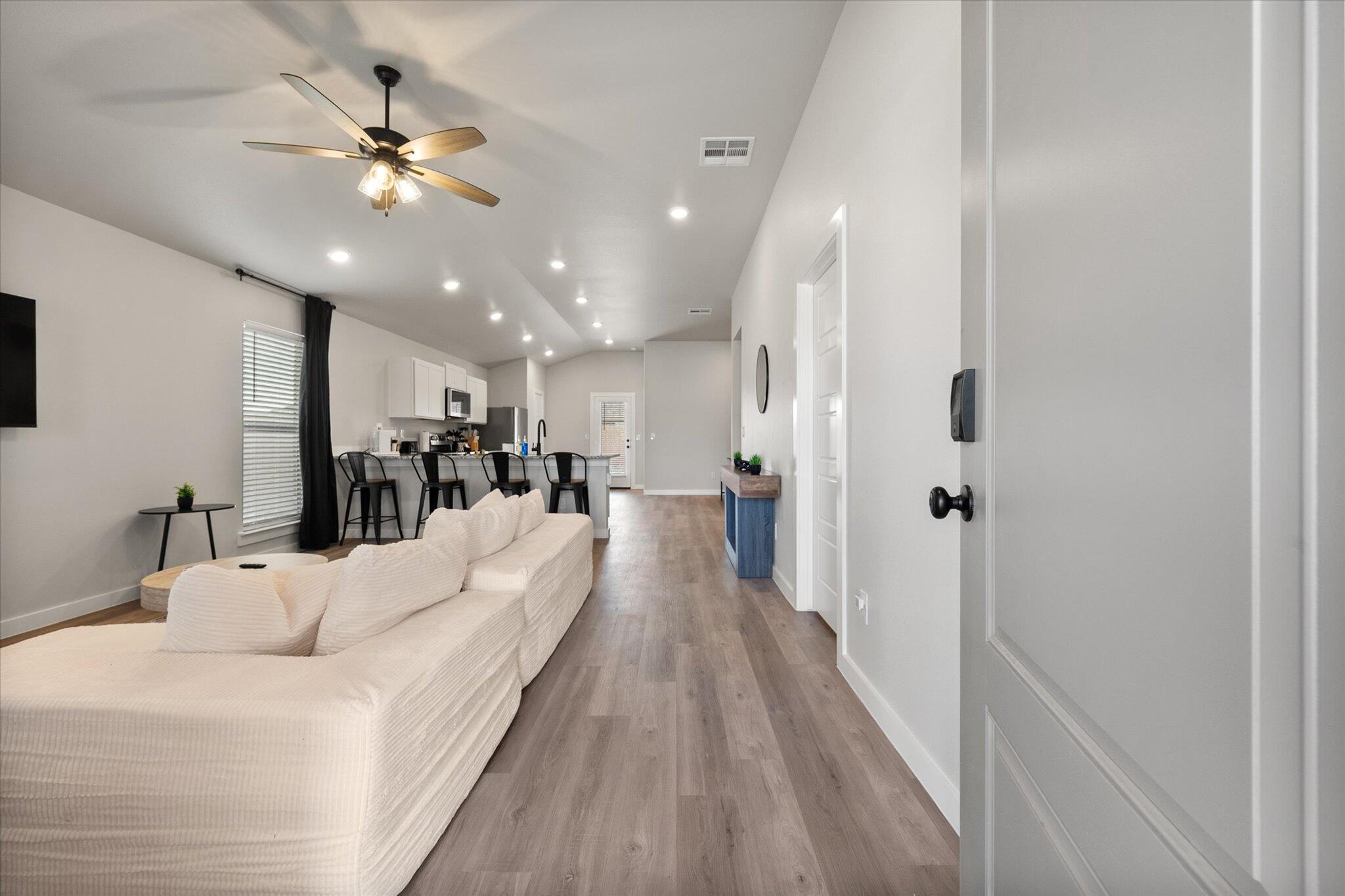 2146 Kokomo Avenue Lubbock, TX 79407 - Photo 2 of 10 a view of a living room and a chandelier fan