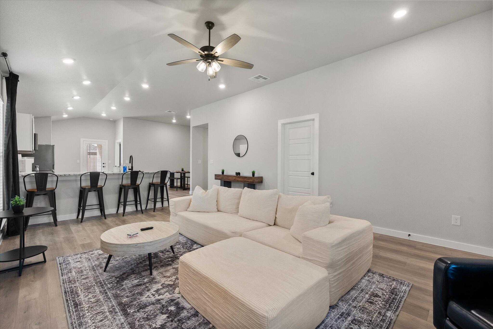 2146 Kokomo Avenue Lubbock, TX 79407 - Photo 3 of 10 a living room with lots of furniture and view of kitchen
