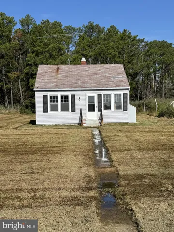 a front view of a house with yard
