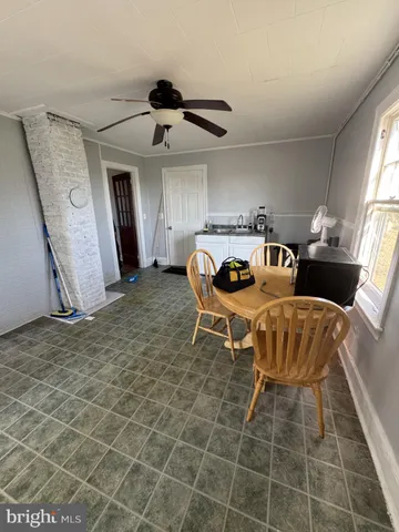 a living room with a couch and a rug