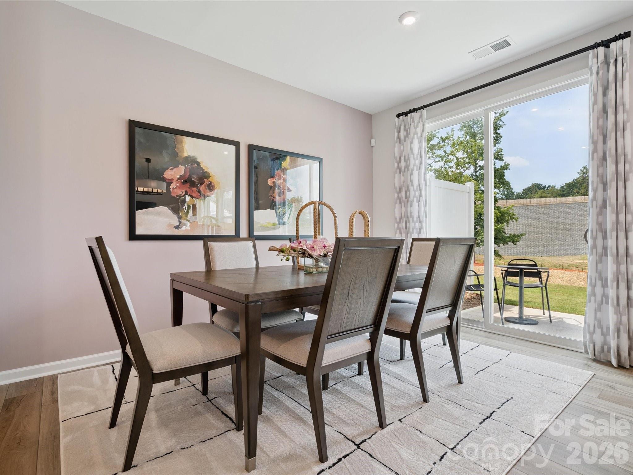 604 Webster Lane Cramerton, NC 28032 - Photo 11 of 20 a view of a dining room with furniture large window and garden view