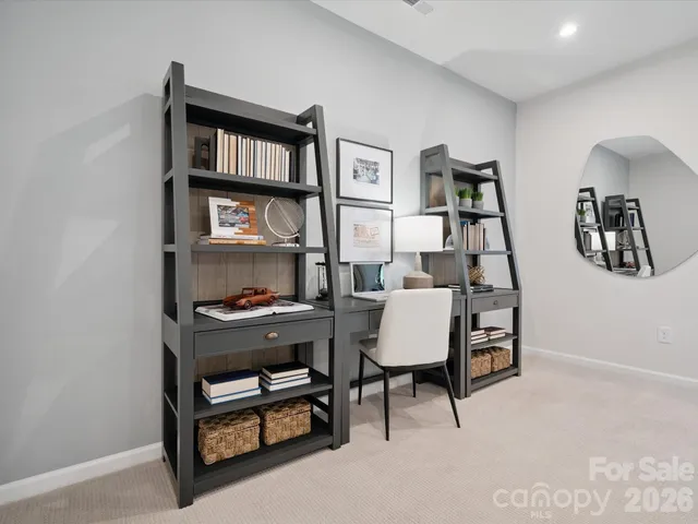 a bed room with a bed and a chandelier