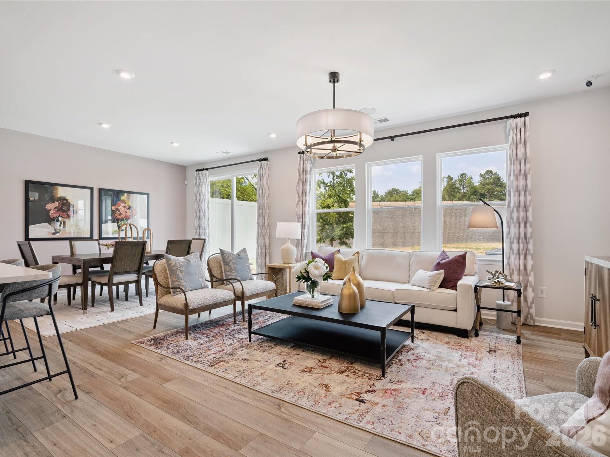 604 Webster Lane Cramerton, NC 28032 - Photo 4 of 20 a living room with furniture and a chandelier
