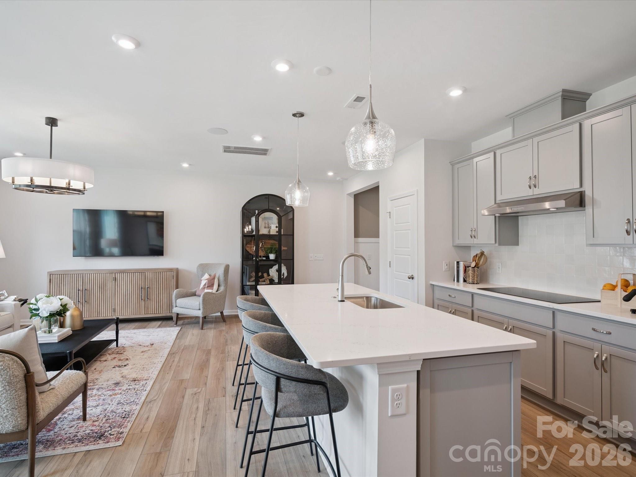 604 Webster Lane Cramerton, NC 28032 - Photo 6 of 20 a kitchen with stainless steel appliances kitchen island granite countertop a sink and a refrigerator