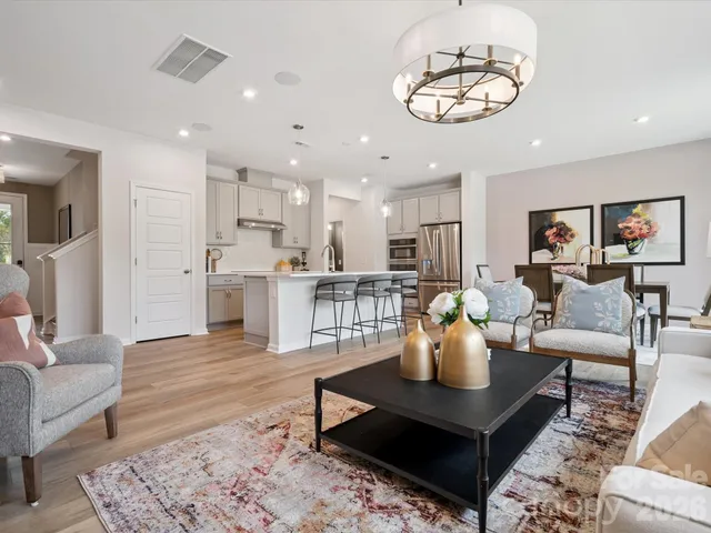 a view of a dining room with furniture large window and garden view