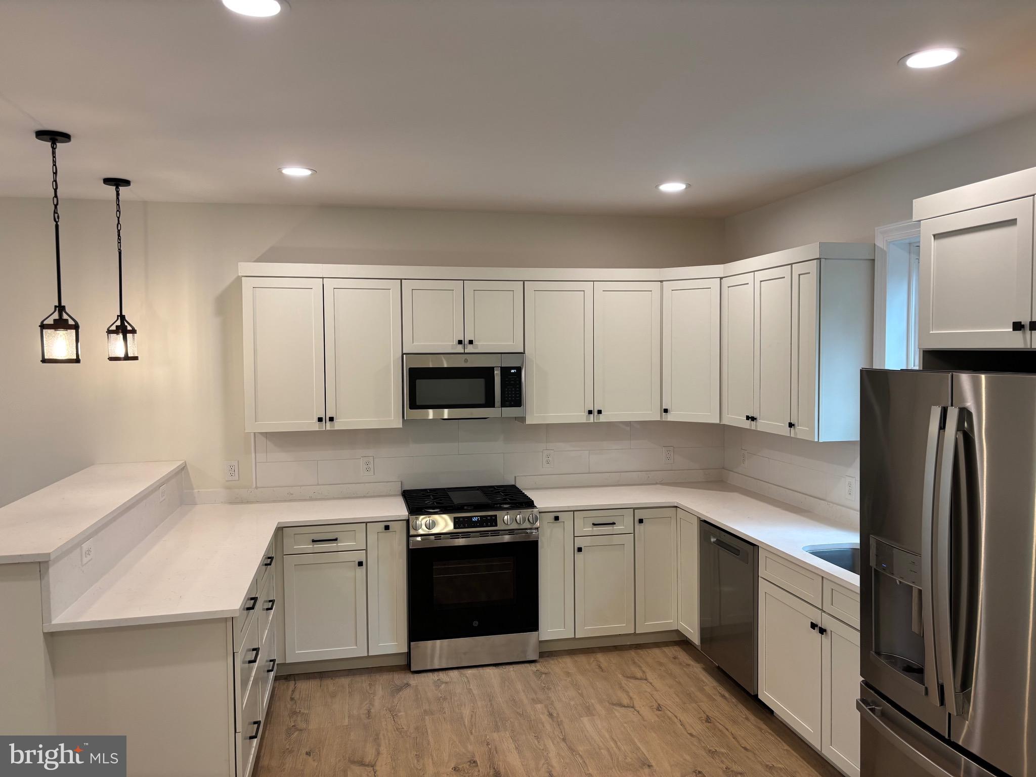 7 Orchard Alley Spring Spring City, PA 19475 - Photo 8 of 47 a kitchen with stainless steel appliances a refrigerator sink and microwave