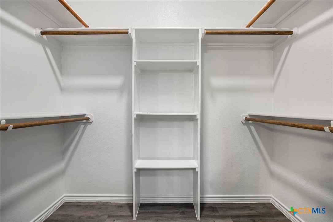 7713 Purvis Street Temple, TX 76502 - Photo 18 of 29 a view of walk in closet with empty racks
