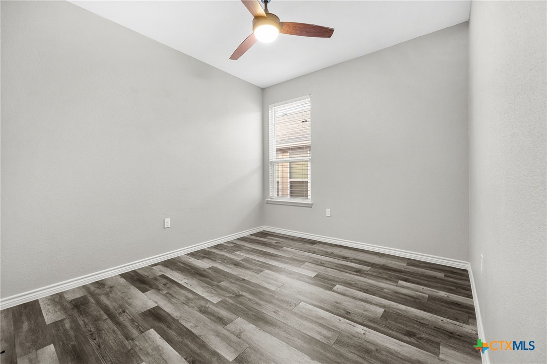 7713 Purvis Street Temple, TX 76502 - Photo 23 of 29 a view of room with window and ceiling fan