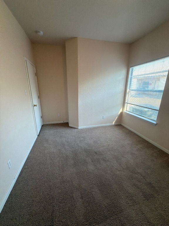 2831 Southampton Way Round Rock, TX 78664 - Photo 16 of 18 an empty room with windows