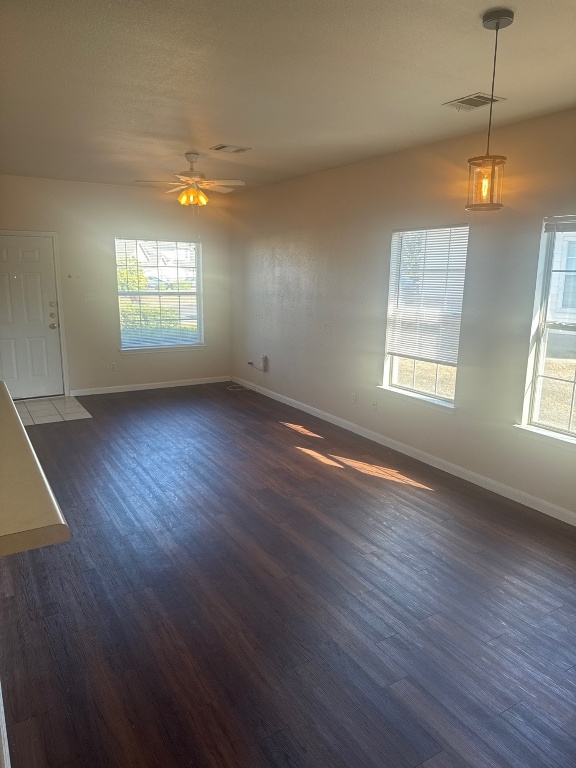 2831 Southampton Way Round Rock, TX 78664 - Photo 7 of 18 an empty room with wooden floor and windows