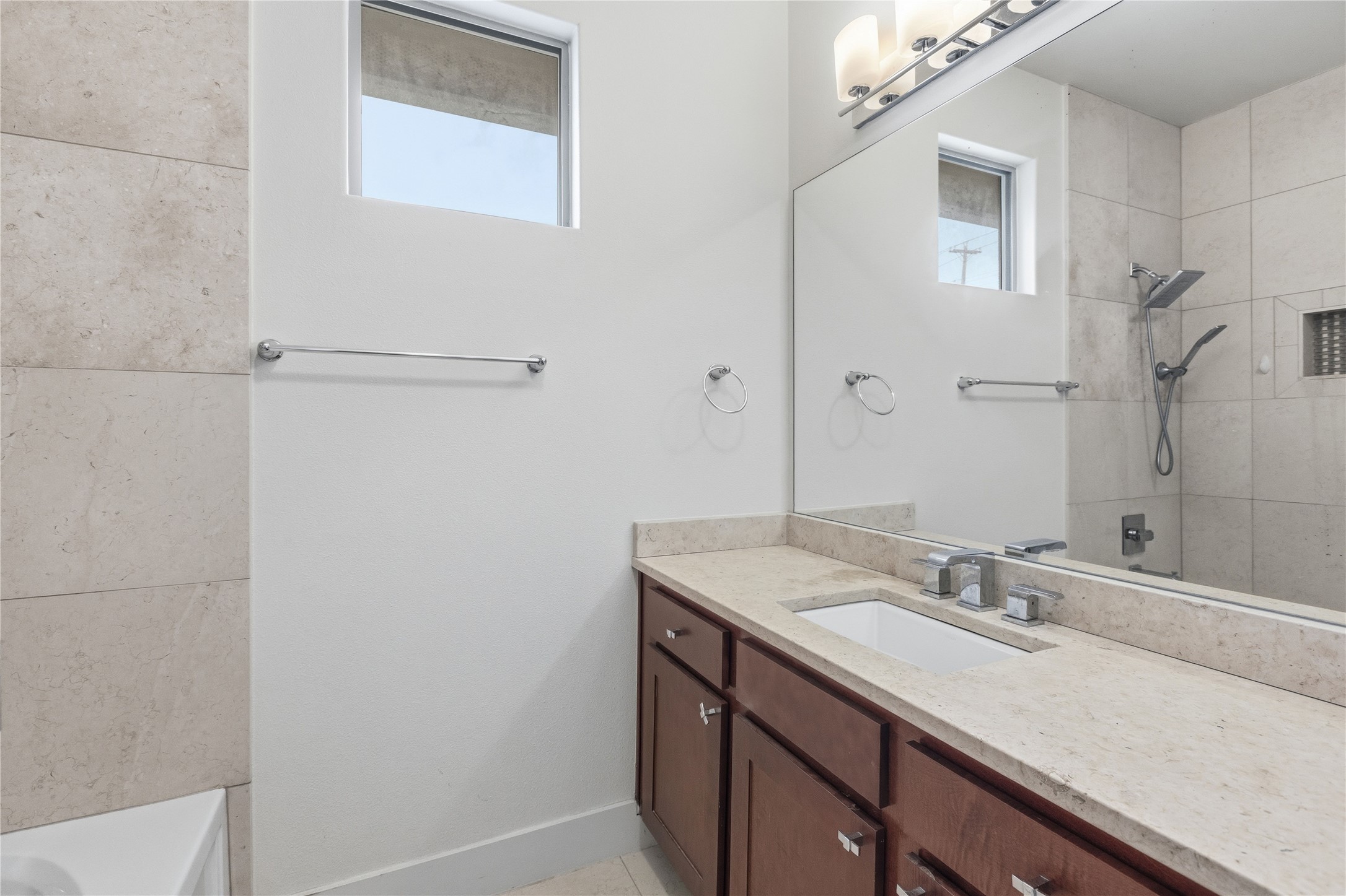 4124 Valley View Road, Unit 4B Austin, TX 78704 - Photo 30 of 32 A well-appointed bathroom with a spacious vanity and contemporary fixtures.