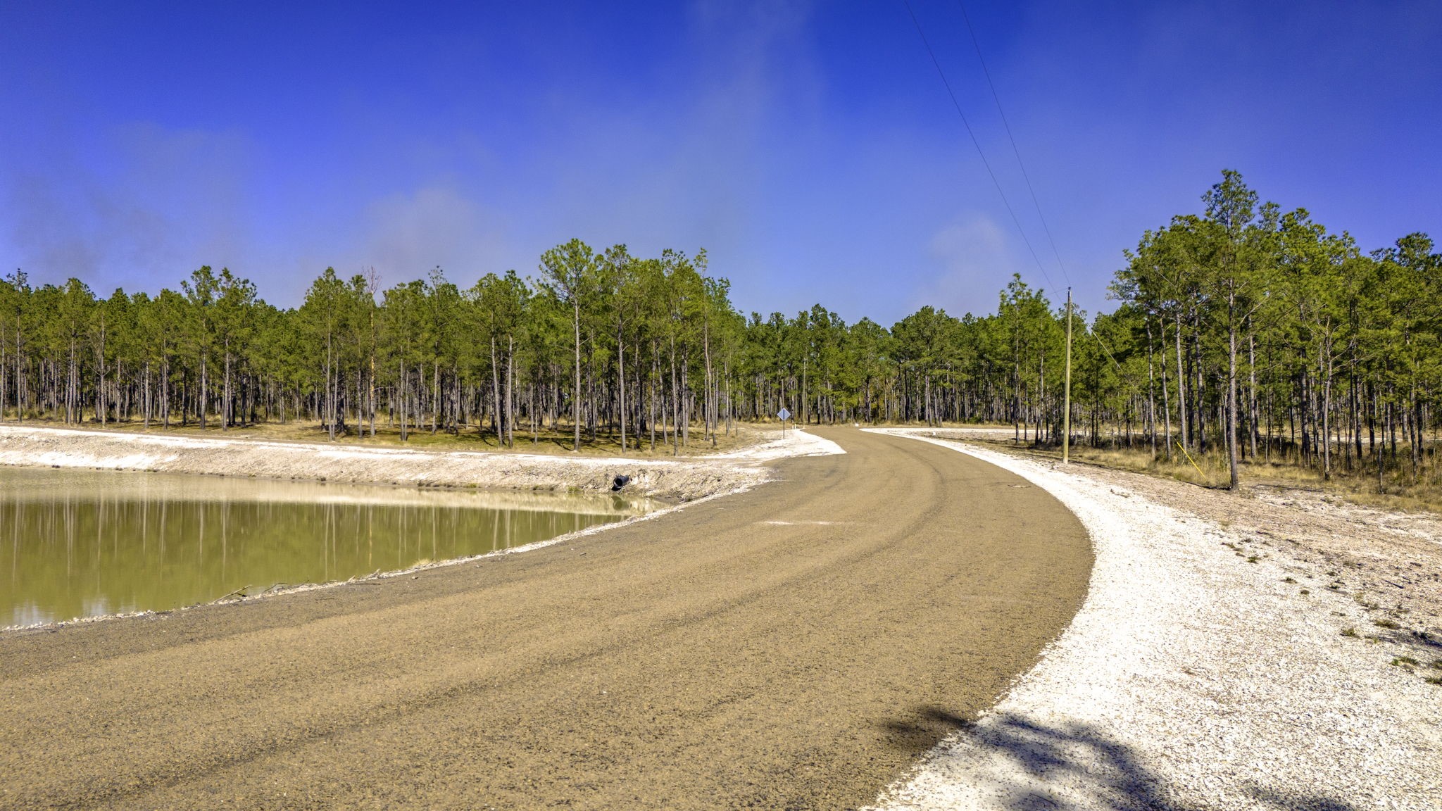 412 Tumbleweed Ranch Road Onalaska, TX 77360 - Photo 5 of 17 Subdivision features paved roads, a community pond, and jogging path!