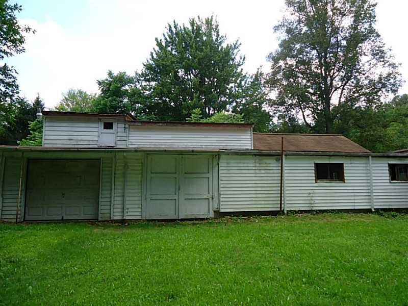 312 Elmbrook Road Beaver Falls, PA 15010 - Photo 20 of 24 Parking Lot/Garage. Door on left side holds 2 cars, Other door goes into storage areas.