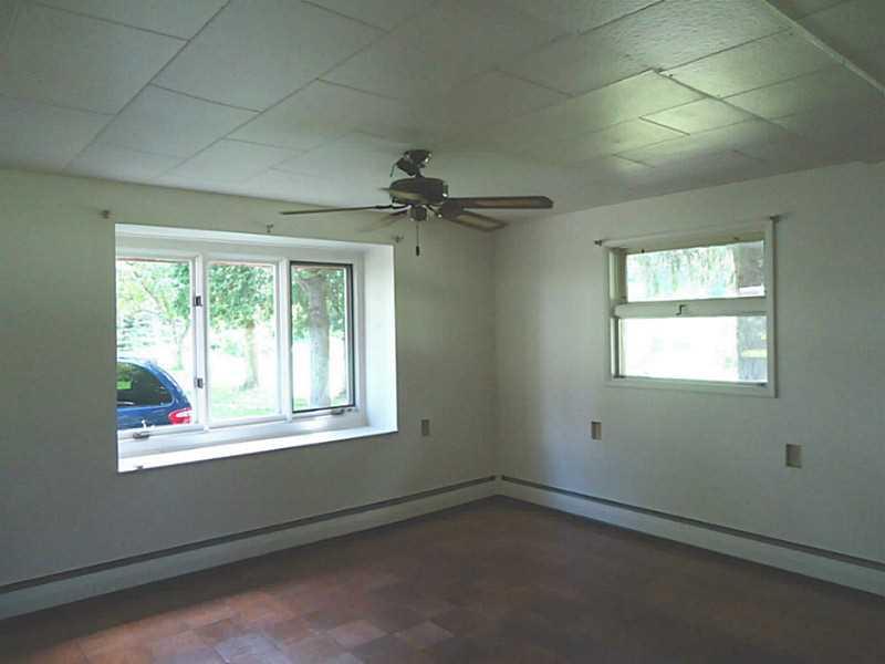 312 Elmbrook Road Beaver Falls, PA 15010 - Photo 3 of 24 Living Room. Light and bright room with parquet flooring.