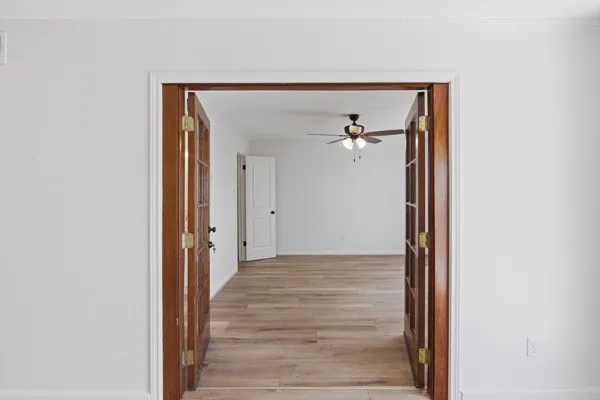 a view of a livingroom from a hallway