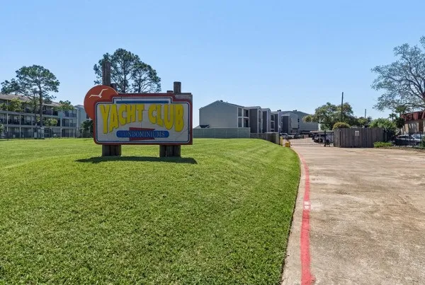 a garden with trees in the background