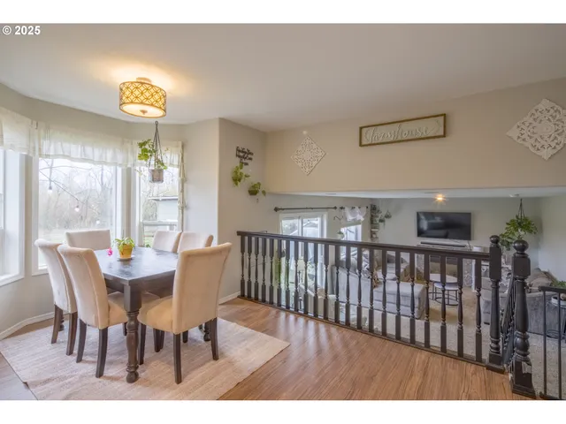 a view of a dining room with furniture window and outside view