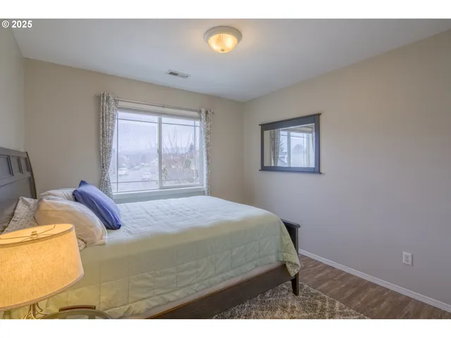 a bedroom with a bed and window